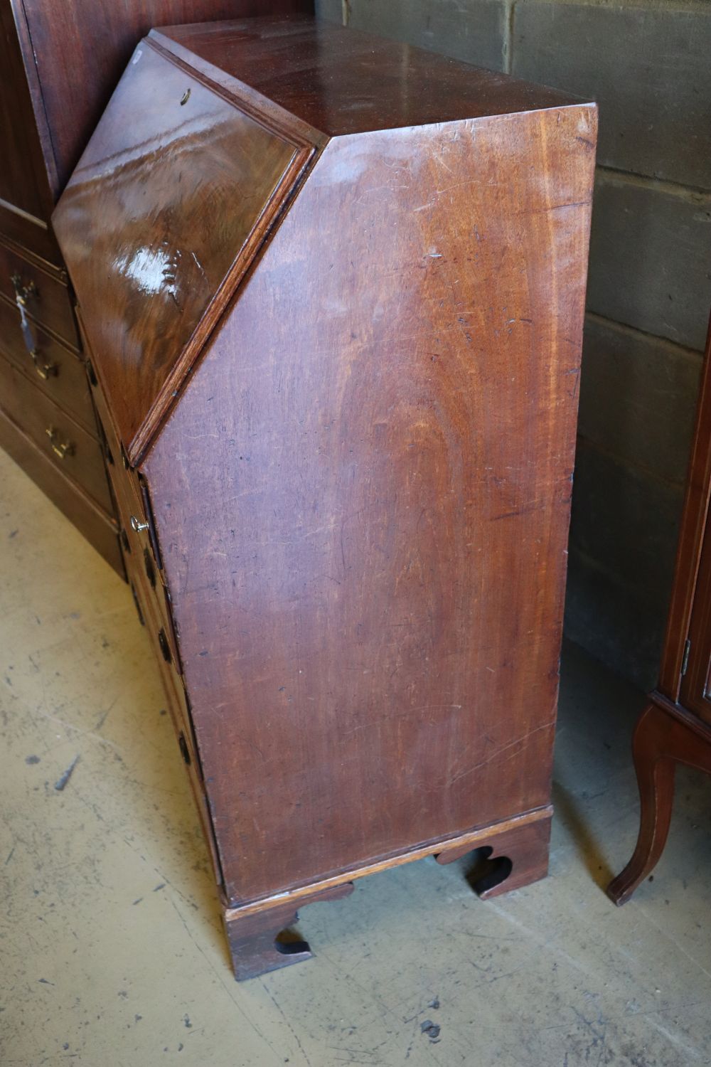 A George III mahogany bureau, fitted four long drawers, width 99cm